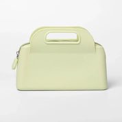 Borsa a mano in pelle verde chiaro con manico integrato, design elegante e moderno, perfetta per moda donna, accessorio di lusso.