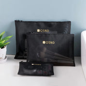 Set di tre pochette organizer nere in rete QSND per cosmetici, con zip, ideali per viaggi e organizzazione trucco. Design elegante e funzionale.