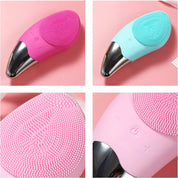 Dispositivo di pulizia viso in silicone rosa e azzurro, con testina vibrante e pulsanti di controllo. Strumento skincare per esfoliazione e massaggio.