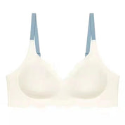 Reggiseno bianco senza cuciture con spalline blu, design confortevole e supporto leggero, ideale per uso quotidiano. Intimo donna elegante.