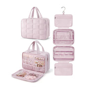 Borsa organizer da viaggio rosa con ganci, tasche trasparenti e scomparti multipli per cosmetici e accessori. Design elegante e funzionale.