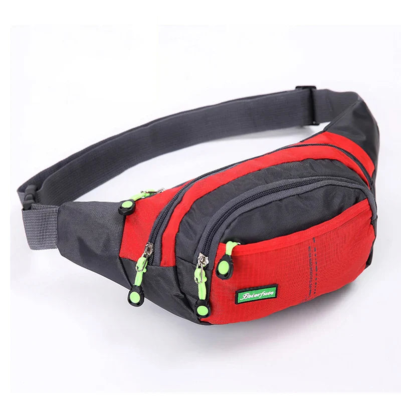 Marsupio sportivo rosso e grigio con cerniere verdi, ideale per attività all'aperto. Design compatto e resistente, perfetto per escursioni e viaggi.
