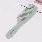 Pettine grigio in plastica con denti larghi, ideale per capelli ricci o mossi. Design ergonomico, marchio "Salon Fashion". Accessorio per styling capelli.