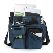 Borsa organizer blu con tasche multiple, contenente laptop, tablet, bottiglia d'acqua e accessori. Ideale per lavoro e viaggio.