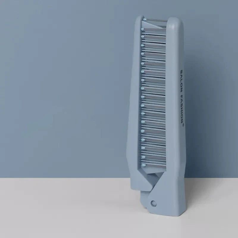 Pettine pieghevole blu per capelli, design compatto, ideale per viaggi e uso quotidiano. Accessorio moda capelli, pratico e portatile.