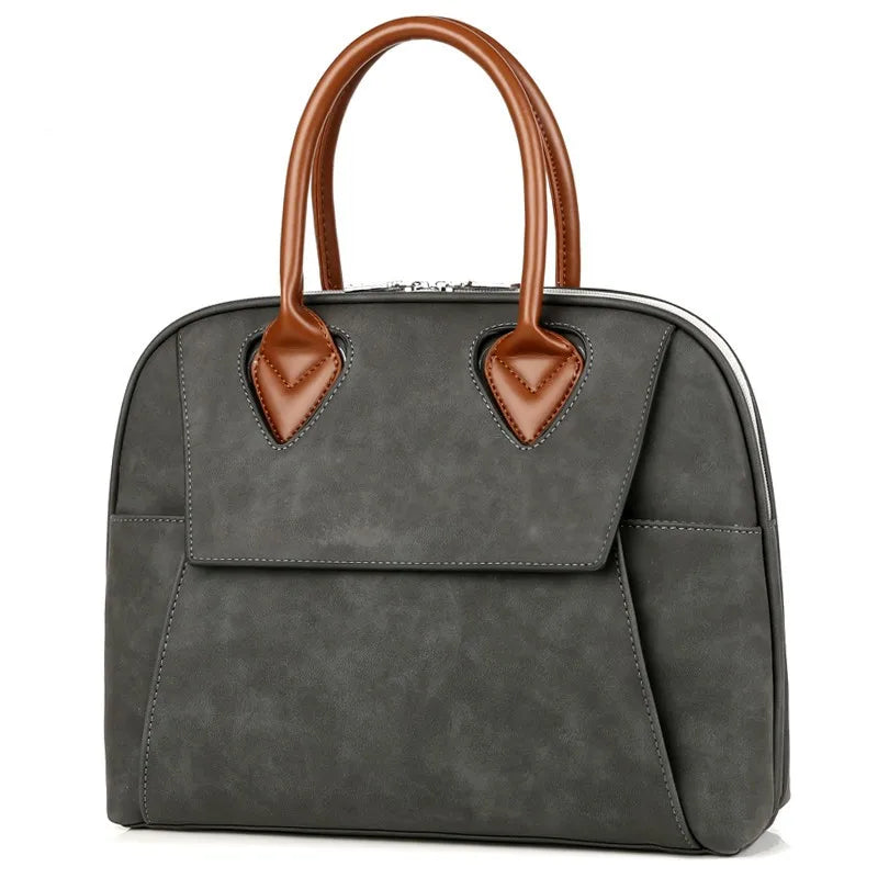 Borsa a mano elegante in pelle grigia con manici marroni, design moderno, ideale per donna, accessorio moda, perfetta per lavoro e tempo libero.