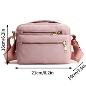 Borsa a tracolla rosa in nylon impermeabile, dimensioni 21x16x10 cm, con cerniere dorate e tasche multiple, ideale per donna.