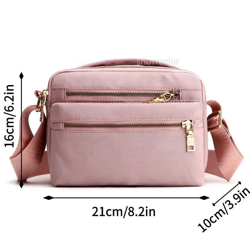 Borsa a tracolla rosa in nylon impermeabile, dimensioni 21x16x10 cm, con cerniere dorate e tasche multiple, ideale per donna.