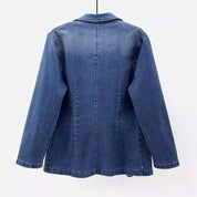 Giacca di jeans blu da donna, design classico, maniche lunghe, cuciture visibili, ideale per moda casual e streetwear.