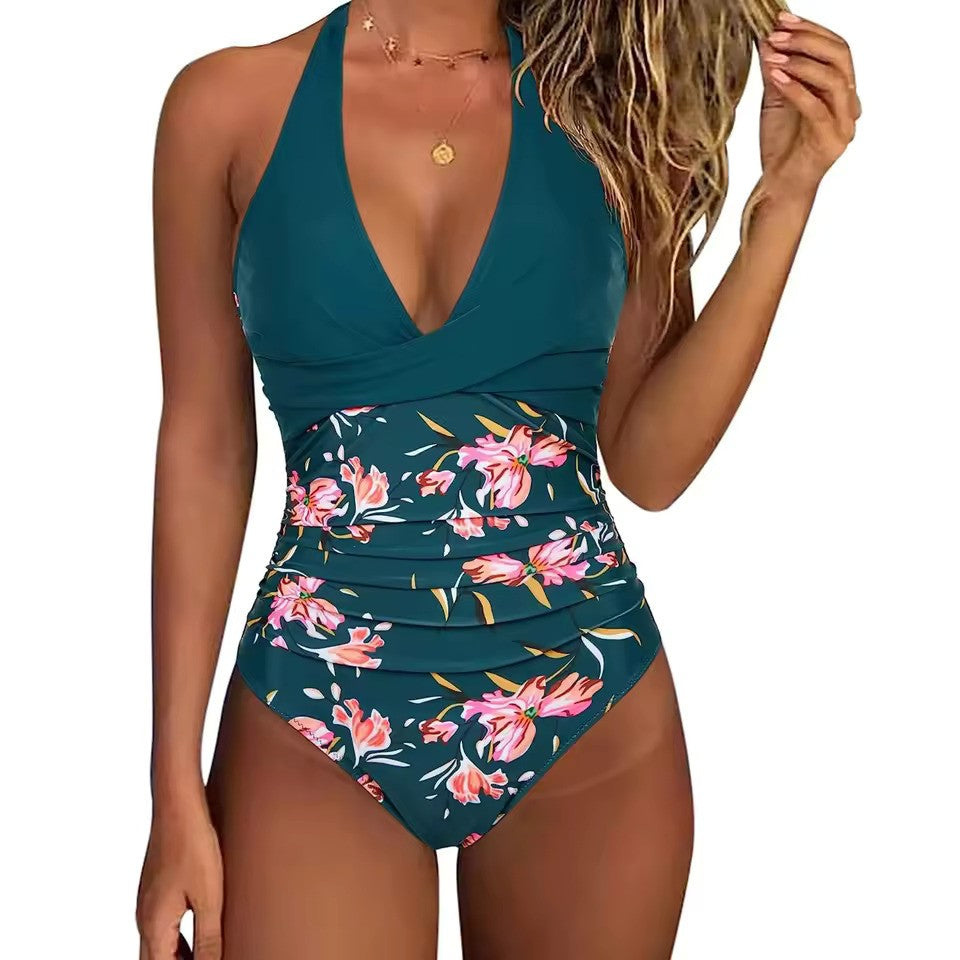 Costume intero donna verde con stampa floreale, scollo a V, spalline regolabili. Elegante e alla moda, perfetto per la spiaggia o la piscina.