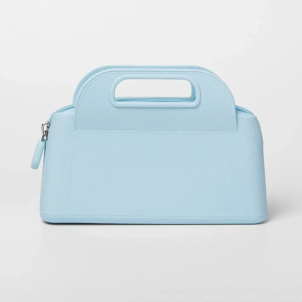Borsa a mano in pelle azzurra, design elegante e moderno, chiusura con zip, ideale per moda femminile e accessori di lusso.