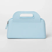 Borsa a mano in pelle azzurra con manico integrato, design elegante e moderno, ideale per moda femminile e accessori di lusso.