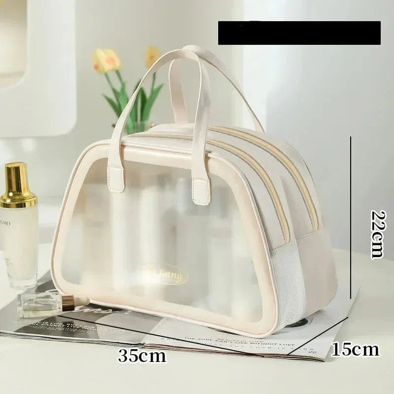 Borsa trasparente da viaggio in PVC, dimensioni 35x22x15 cm, con manici beige. Ideale per cosmetici, accessori, resistente all'acqua.