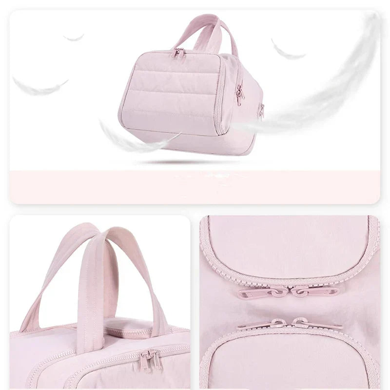 Borsa da viaggio rosa chiaro con manici resistenti e cerniere doppie, design elegante e spazioso, ideale per viaggi e uso quotidiano.