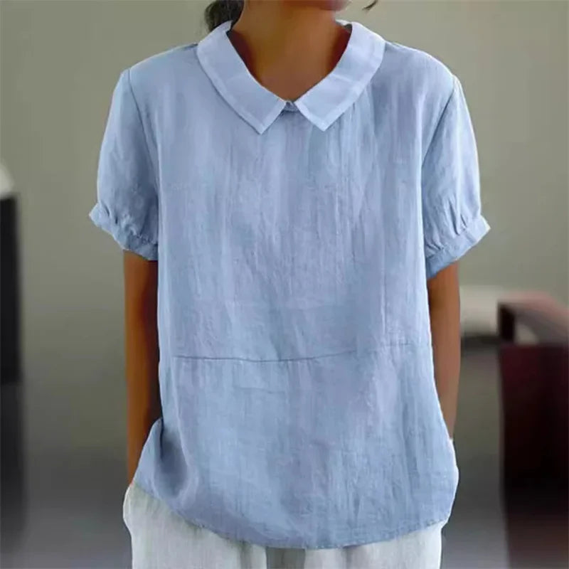 Camicia donna in lino azzurro, maniche corte, colletto classico, stile casual. Ideale per look estivi e primaverili. Moda femminile elegante.