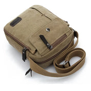 Borsa a tracolla in tela marrone, design compatto con tasca frontale e cerniera, ideale per uomo, stile casual e resistente.