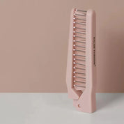 Pettine lisciante rosa per capelli, design ergonomico, ideale per styling professionale, riduce l'effetto crespo, adatto a tutti i tipi di capelli.