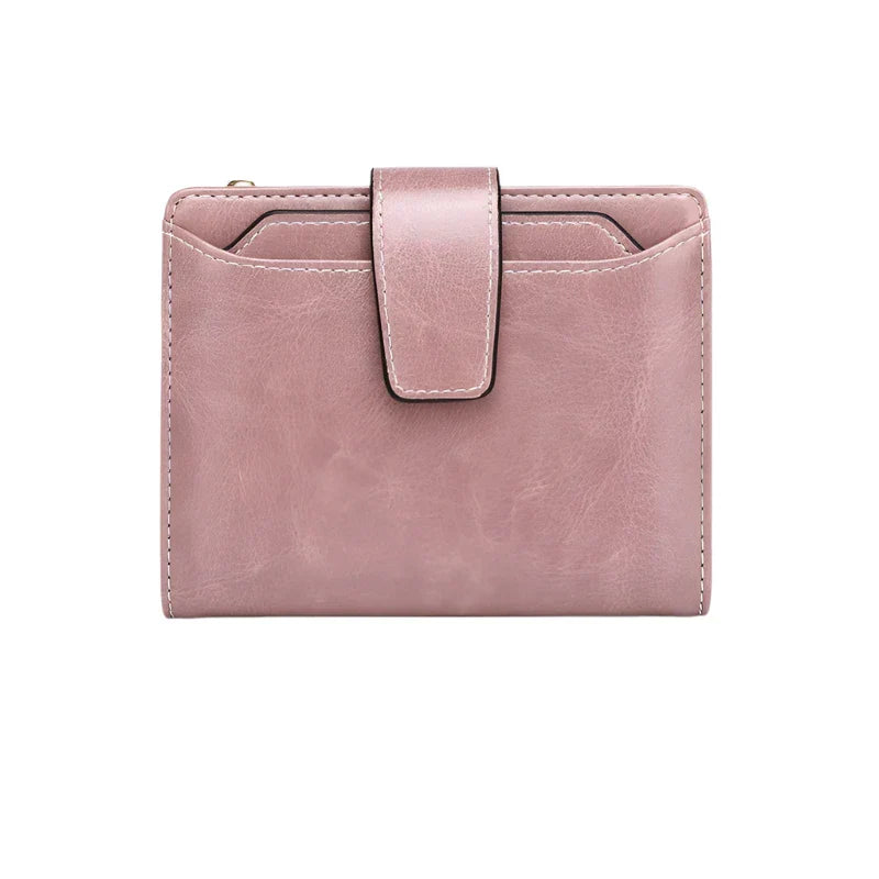 Portafoglio donna in pelle rosa con chiusura a bottone, design compatto e moderno, ideale per carte e contanti. Accessorio moda elegante.