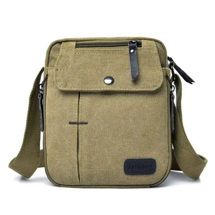 Borsa a tracolla in tela verde oliva, design compatto con tasca frontale e chiusura a zip, ideale per uomo, stile casual e resistente.