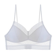 Reggiseno bianco trasparente con spalline sottili, design a righe e dettagli a pois. Intimo femminile elegante e moderno.