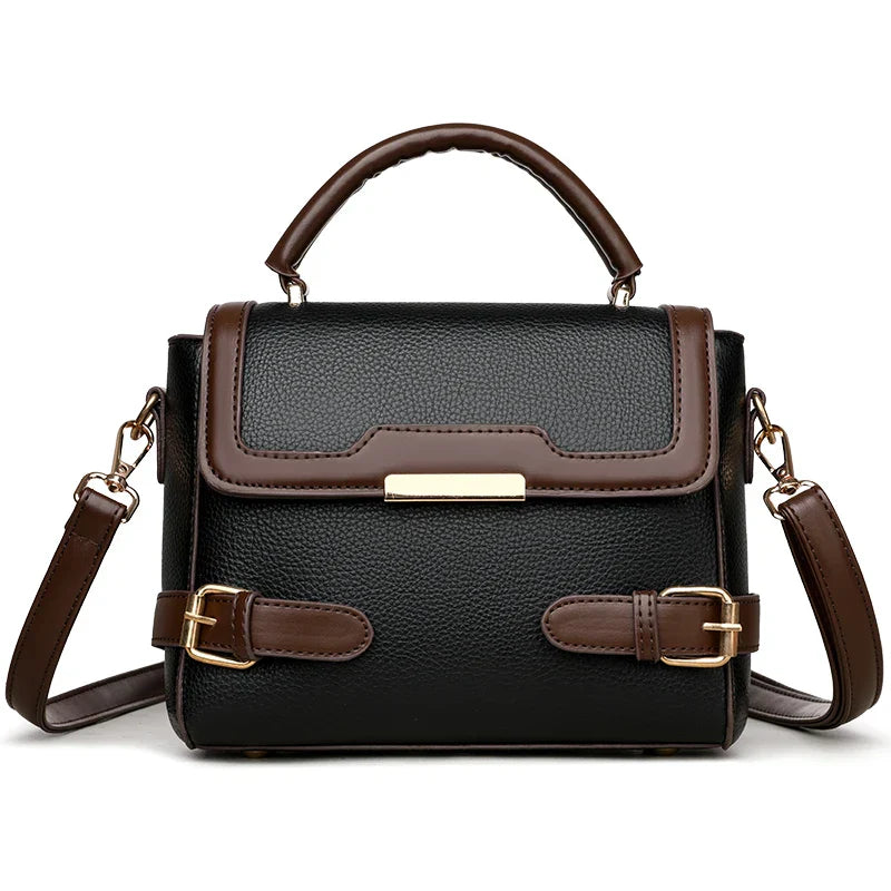 Borsa a tracolla donna in pelle nera e marrone, design elegante con fibbie dorate, manico superiore e tracolla regolabile. Accessorio moda chic.