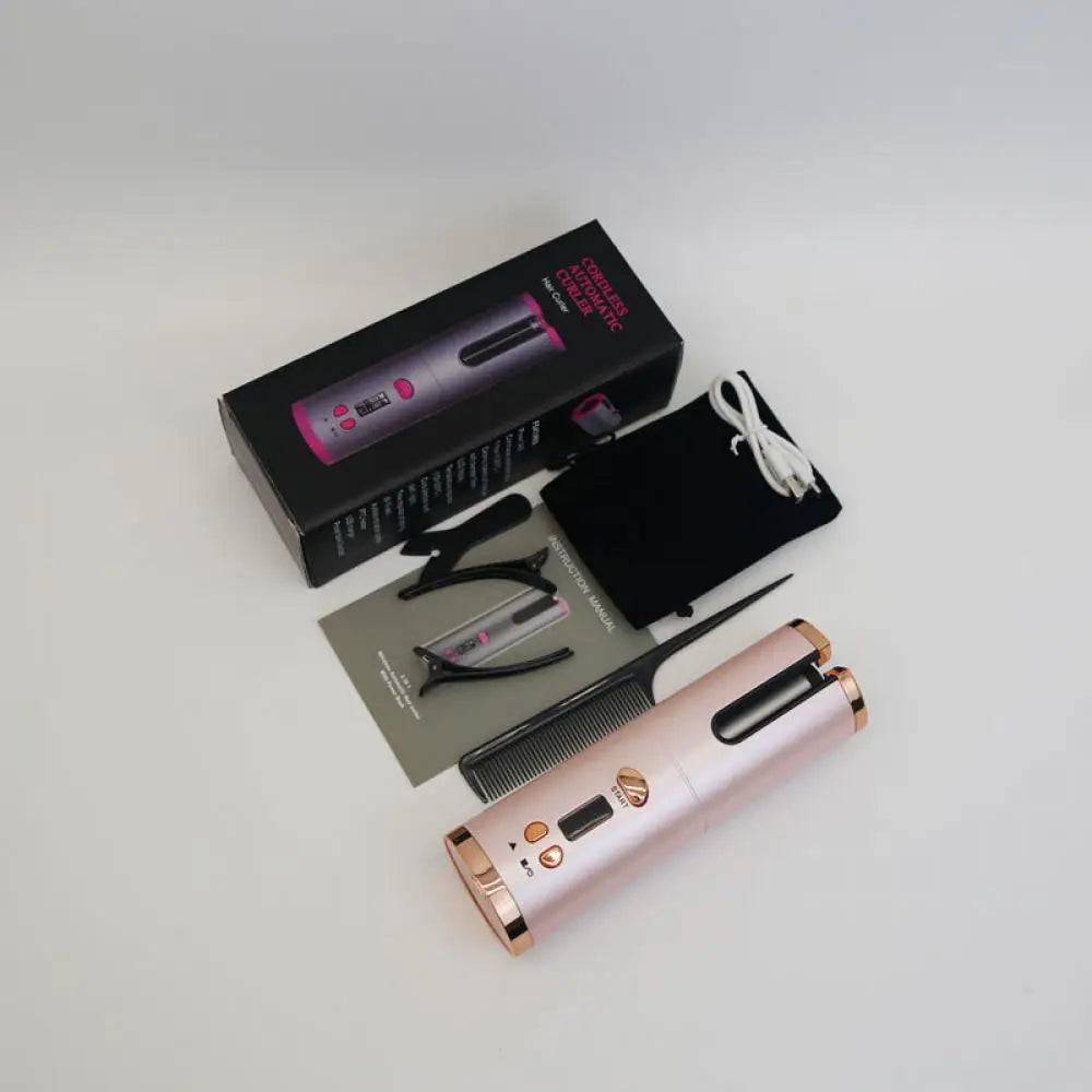 Arricciacapelli automatico rosa con accessori: pettine, cavo USB, pinze e manuale. Confezione elegante, ideale per styling capelli professionale.