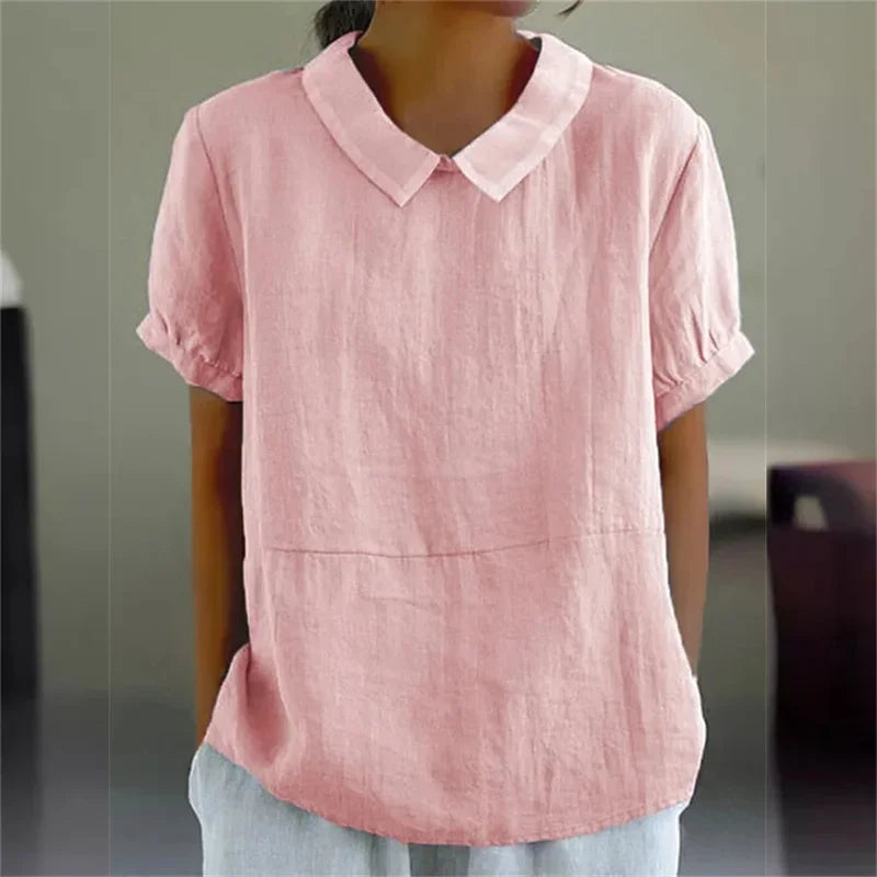 Camicia donna in lino rosa con colletto Peter Pan, maniche corte, stile casual. Ideale per look estivi e primaverili.