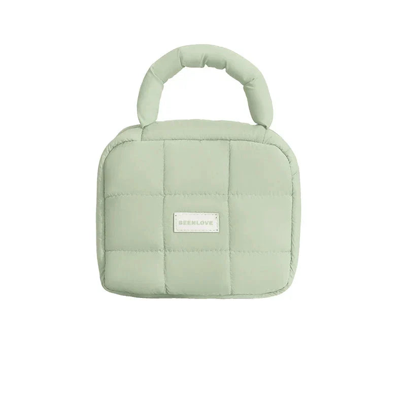Borsa termica verde menta imbottita, manico superiore, design a quadri, ideale per pranzo al sacco, marchio visibile, accessorio moda pratico.