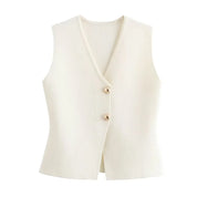 Gilet donna bianco crema, senza maniche, con scollo a V e due bottoni frontali. Elegante e versatile, ideale per moda casual e formale.