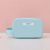 Astuccio trucco azzurro con manico, design minimalista, etichetta "Makeup Beauty", ideale per cosmetici, accessori viaggio, organizzazione.