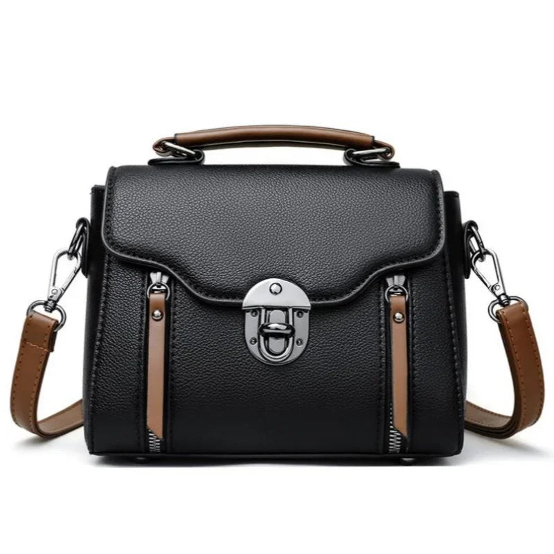 Borsa a tracolla in pelle nera con manico marrone, chiusura a scatto in metallo, design elegante e moderno, ideale per moda donna.