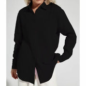 Camicia nera da donna, maniche lunghe, stile casual, tessuto morbido, perfetta per look eleganti e quotidiani. Ideale per moda autunnale.