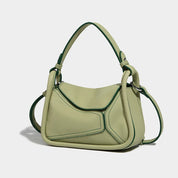 Borsa a tracolla verde chiaro in pelle, design moderno con dettagli cuciti, manico regolabile. Accessorio moda elegante per donna.