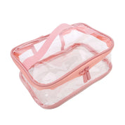 Borsa trasparente da viaggio in PVC con cerniera rosa, ideale per cosmetici e articoli da toeletta. Design compatto e resistente all'acqua.