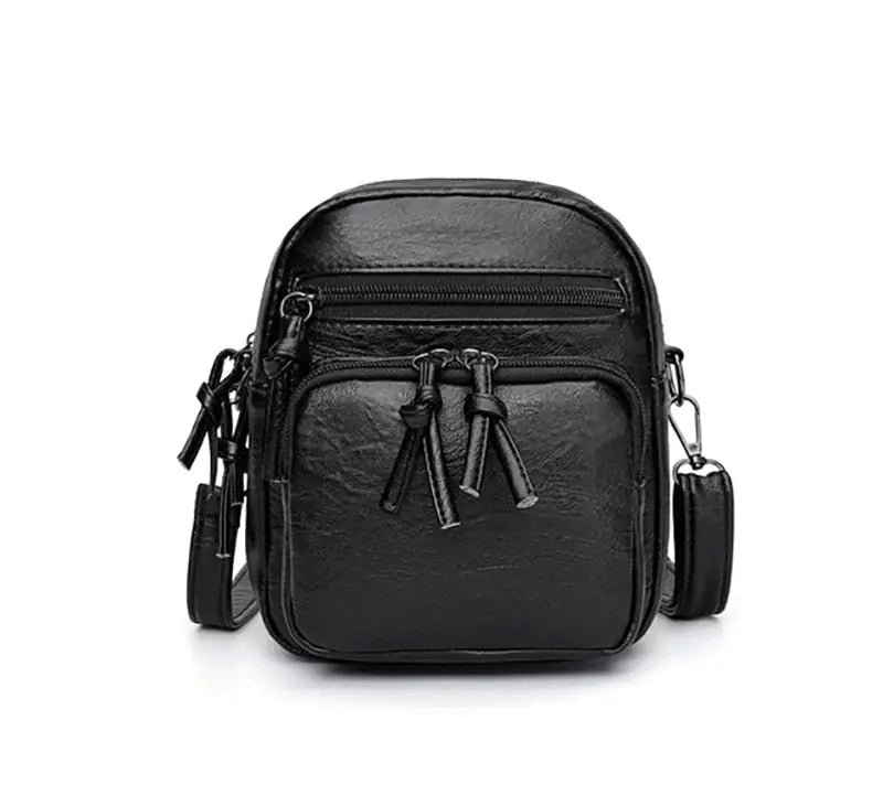 Borsa a tracolla in pelle nera, design compatto con tasche multiple e cerniere, ideale per uomo, accessorio moda pratico ed elegante.