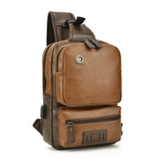 Zaino a tracolla in pelle marrone, design elegante e compatto, con tasche multiple e cerniere, ideale per viaggi e uso quotidiano.