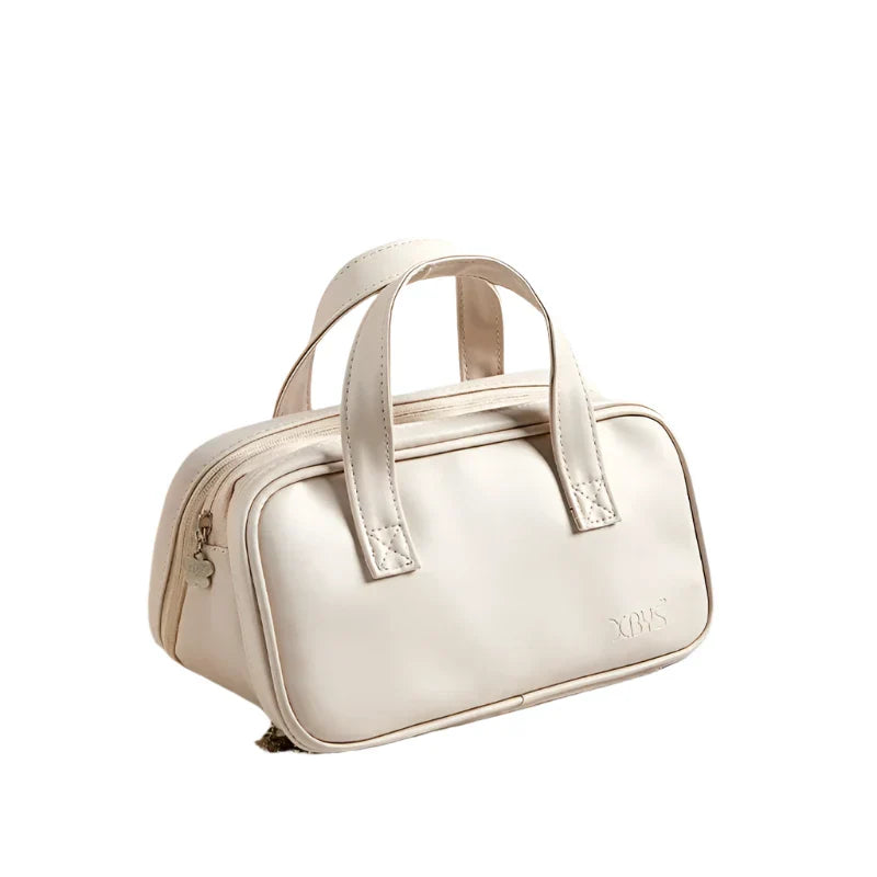 Borsa a mano in pelle bianca, design elegante e compatto, doppio manico, chiusura a zip, ideale per moda donna e accessori di lusso.