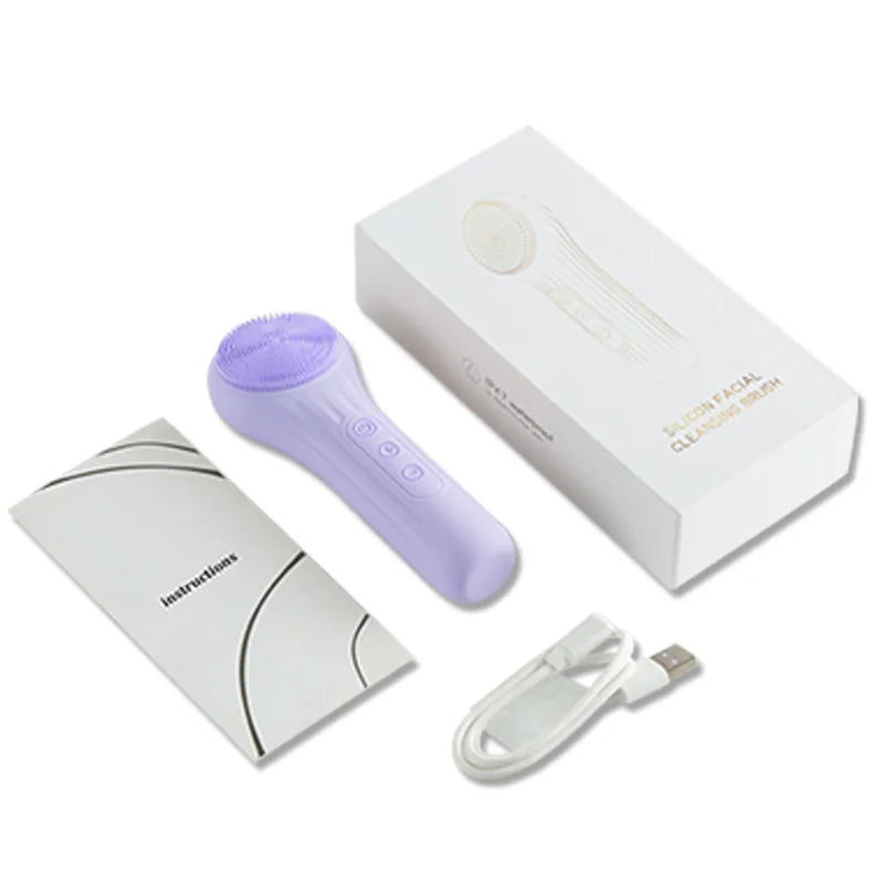 Spazzola pulizia viso in silicone viola con confezione, cavo USB e manuale. Dispositivo skincare elettrico per pulizia profonda e massaggio viso.