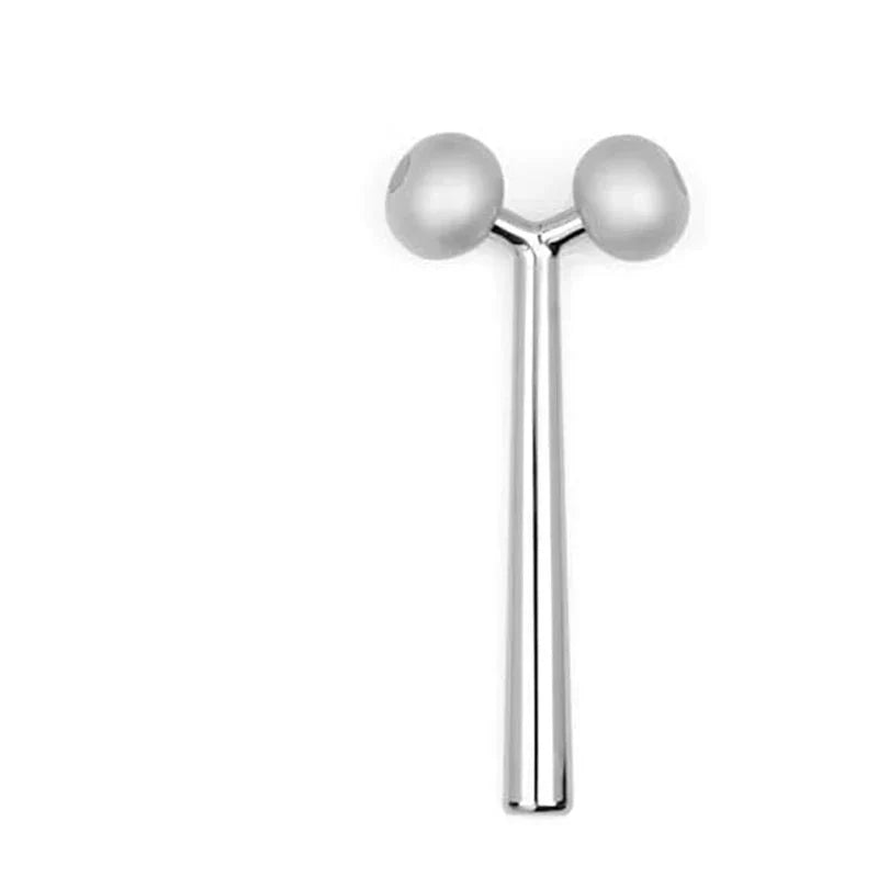 Rullo massaggiante viso in acciaio inox, doppia sfera, per lifting e tonificazione pelle. Strumento bellezza anti-età, cura viso efficace.