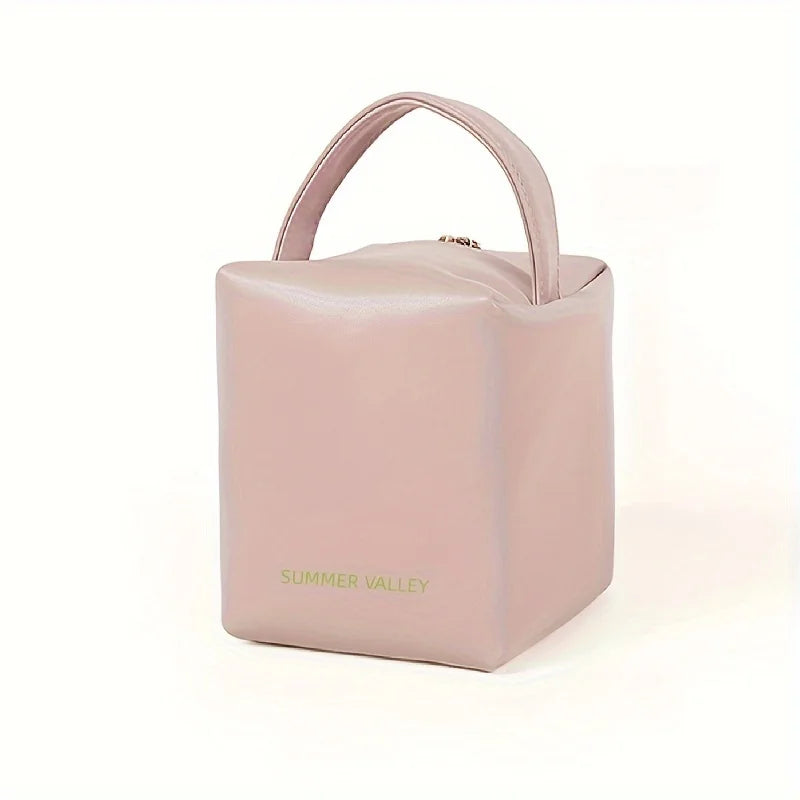 Borsa termica rosa quadrata con manico, design minimalista, ideale per picnic e viaggi. Perfetta per mantenere cibi e bevande freschi.
