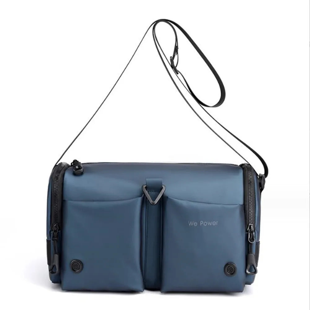 Borsa a tracolla blu in nylon impermeabile con tasche multiple e cerniere, design moderno e funzionale, ideale per viaggi e uso quotidiano.