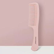 Pettine rosa in plastica, design ergonomico, marchio "Salon Fashion", su sfondo rosa. Accessorio per capelli, ideale per styling e cura quotidiana.