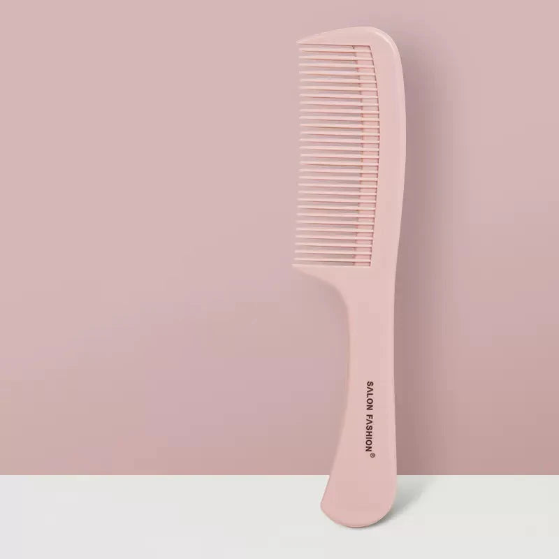 Pettine rosa in plastica, design ergonomico, marchio "Salon Fashion", su sfondo rosa. Accessorio per capelli, ideale per styling e cura quotidiana.