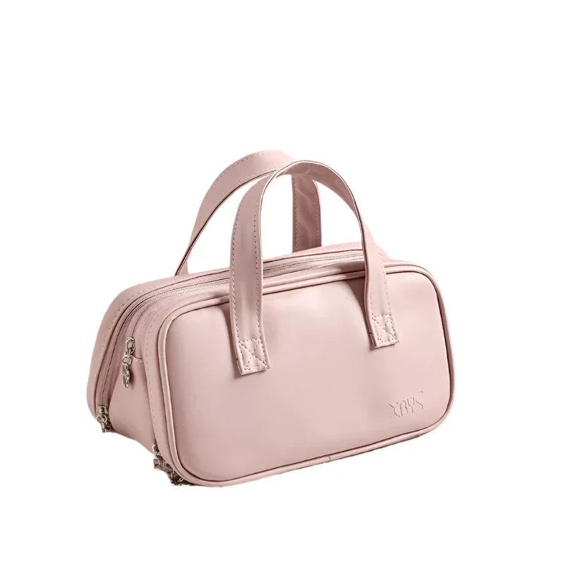 Borsa a mano rosa in pelle, design elegante con doppia cerniera e manici robusti. Ideale per moda donna, accessori di lusso, shopping online.