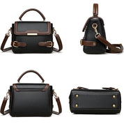 Borsa a tracolla in pelle nera e marrone, design elegante, chiusura a fibbia, manico superiore, dettagli dorati, ideale per moda femminile.