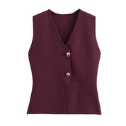 Gilet donna senza maniche bordeaux, chiusura a due bottoni dorati, elegante e moderno, ideale per moda autunnale e invernale.