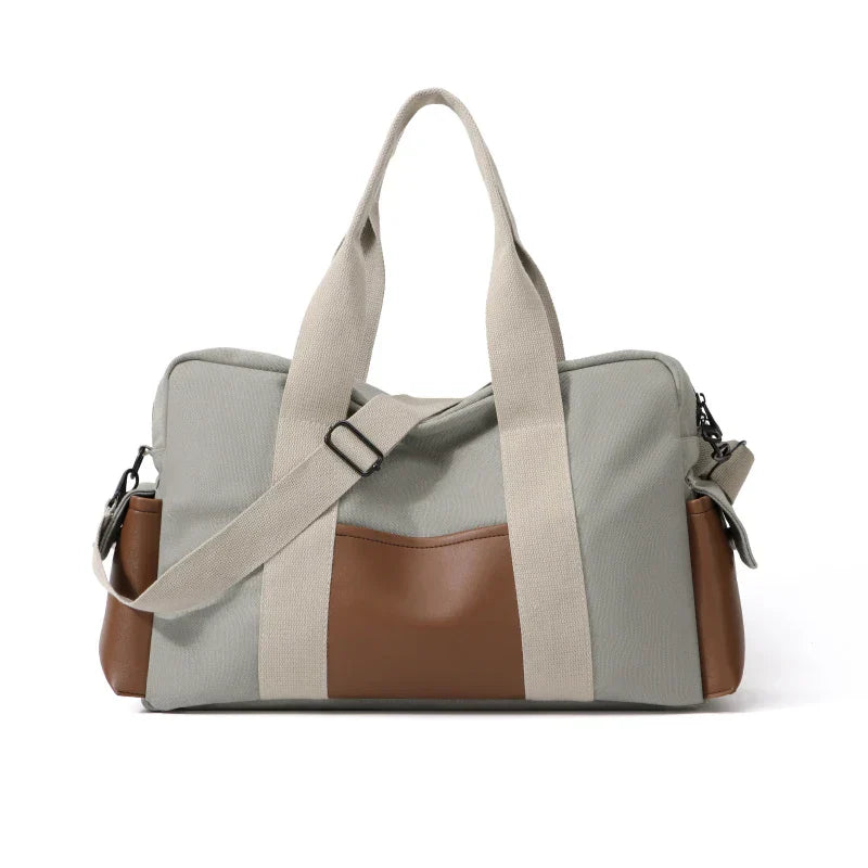 Borsa a tracolla unisex in tessuto grigio e marrone, design moderno, manici robusti, ideale per viaggi e uso quotidiano.