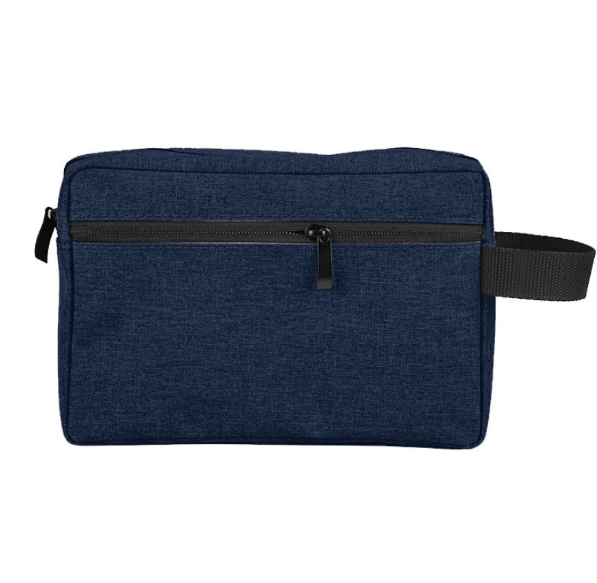 Borsa da toilette blu scuro con cerniera frontale, manico laterale nero, design elegante e compatto, ideale per viaggi e organizzazione.