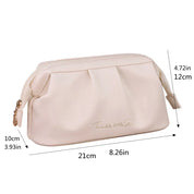 Astuccio cosmetico beige in pelle sintetica, dimensioni 21x10x12 cm, con cerniera dorata e scritta "Twinkle little Star". Ideale per trucco e accessori.