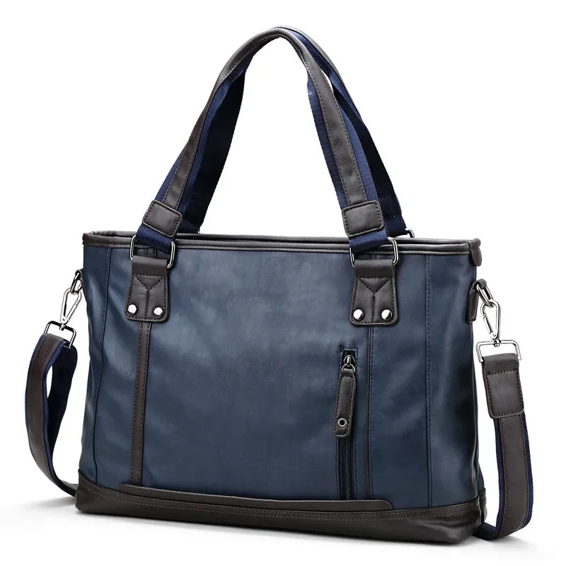 Borsa a tracolla in pelle blu scuro con manici marroni, tasca frontale con zip, design elegante e spazioso, ideale per lavoro e viaggio.